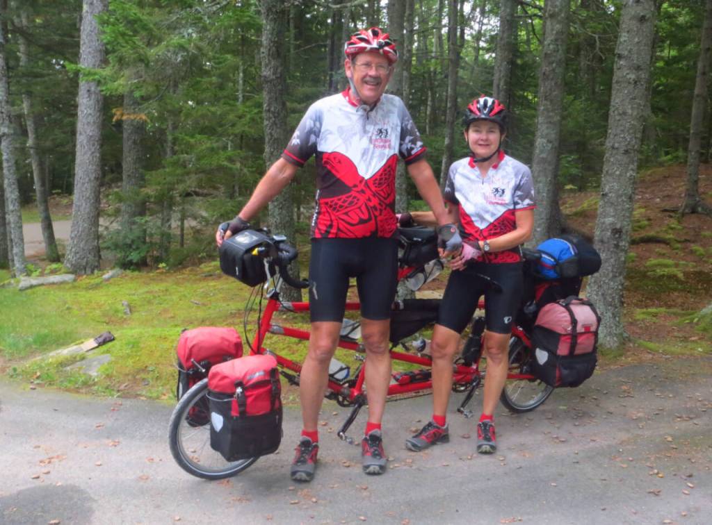 Photo courtesy of Jeff and Louise Davis / Jeff and Louise Davis  pictured here with Little Red, their two-wheeled transportation for their canoeing adventure  offer their thoughts of their 700-mile canoeing, by bike trip up the coast of Maine on March 7 at a 2024 Travelers Journal Series event.