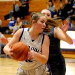 Sequim Gazette photo by Matthew Nash/ Hailey Wagner looks for positioning along the baseline against an Olympic player on Feb. 1.