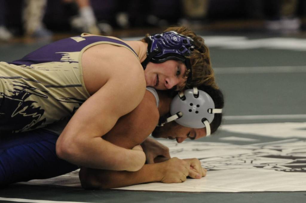 Sequim Gazette photo by Michael Dashiell / Ari Skov of Sequim, left, wrestles Olympics Thomas Swain in the consolation semifinals at a sub-district tournament in Sequim on Feb. 3. Skov won the match by pin and placed third overall.