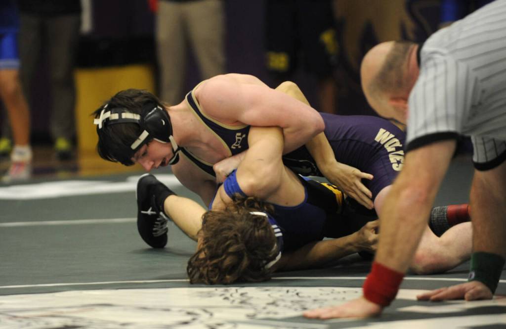 Sequim Gazette photo by Michael Dashiell / Johnny Vilona of Sequim takes control of the sub-regional 126-pound semifinal match against Bremertons Jonah Gregor. Vilona won the match, 4-2, and placed second overall.