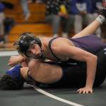 Sequim Gazette photo by Michael Dashiell / Sequims Jayms Vilona, top, works for a technical victory over North Masons Michael Freemier in the 144-pound weight class quarterfinals of a sub-regional tournament in Sequim on Feb. 3. Vilona placed second in the tourney.