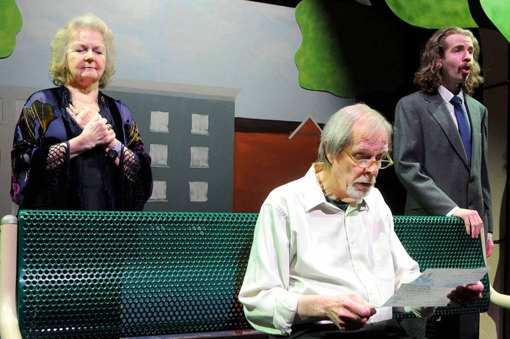 Ralph, played by Pat Owens, reads a letter from Carol (Sharon DelaBarre) as his younger self (Sean McDaniel) sings during a scene from The Last Romance. The show details a possible romance between Carol and Ralph that director Cathy Dodd said is one of those shows you leave with a little hope for the future, a little happiness, a little more upbeat than when you came in.