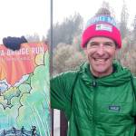 Photo by Pierre LaBossiere/Olympic Peninsula News Group
John Mauro of Port Townsend, the Elwha Bridge Run mens 10k winner, holds up the poster handed out to race winners.