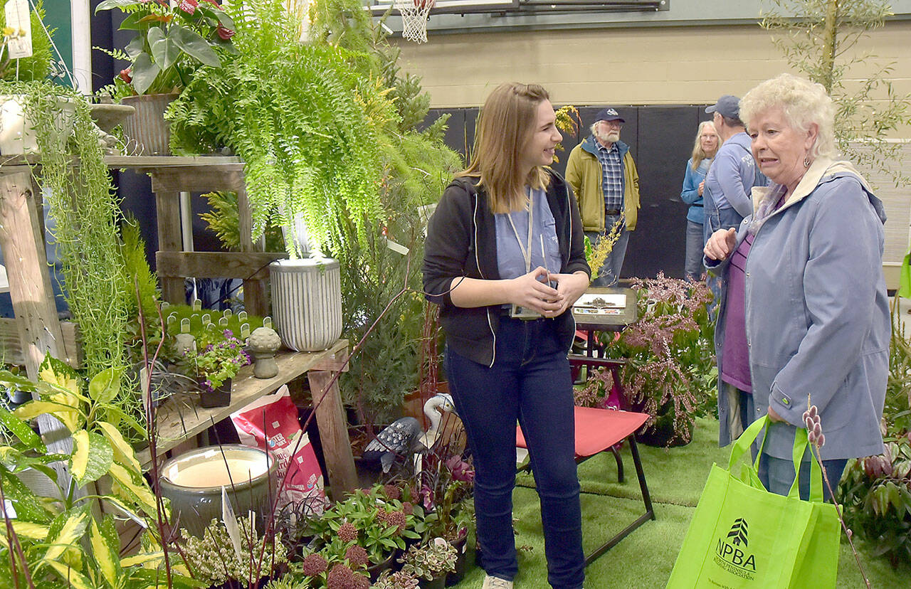 Photo by Keith Thorpe/Olympic Peninsula News Group
Dianne McIntosh of Sequim, right, chats about gardening with Jayde Carean, an employee of New Dungeness Nursery, at the Building, Remodeling & Energy Expo at Sequim Middle School on Feb. 3. The two-day event, hosted by the North Peninsula Building Association and sponsored by Clallam County PUD No. 1., featured displays, workshops and vendor booths showcasing a variety of building products and services.
