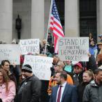 Photo by Aspen Anderson/Washington State Journal / Washingtonians from all over the state gathered on the north steps at the capitol in Olympia, for a rally planned only a week in advance. Protesters displayed signs that read We want hearings and Follow the constitution.