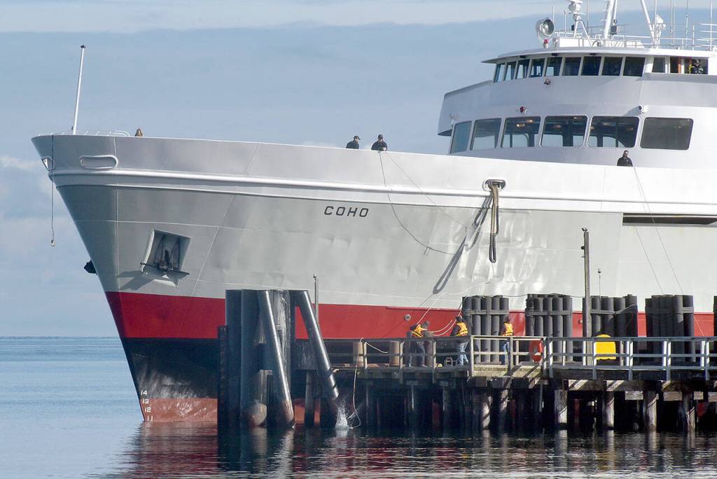 Photo by Keith Thorpe/Olympic Peninsula News Group 
Crew members of the ferry MV Coho secure lines to the dock as the vessel returns to Port Angeles on Feb. 6 after being out of service since early January for annual dry dock and maintenance in Anacortes. The ferry resumed daily service between Port Angeles and Victoria on Feb. 8.