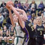 Keith Thorpe/Olympic Peninsula News Group / Sequims Hailey Wagner, center, fights for an errant rebound with Port Angeles Lexie Smith, left, as teammate Jolene Vaara looks on, in a Feb. 6 match-up at Port Angeles High School.