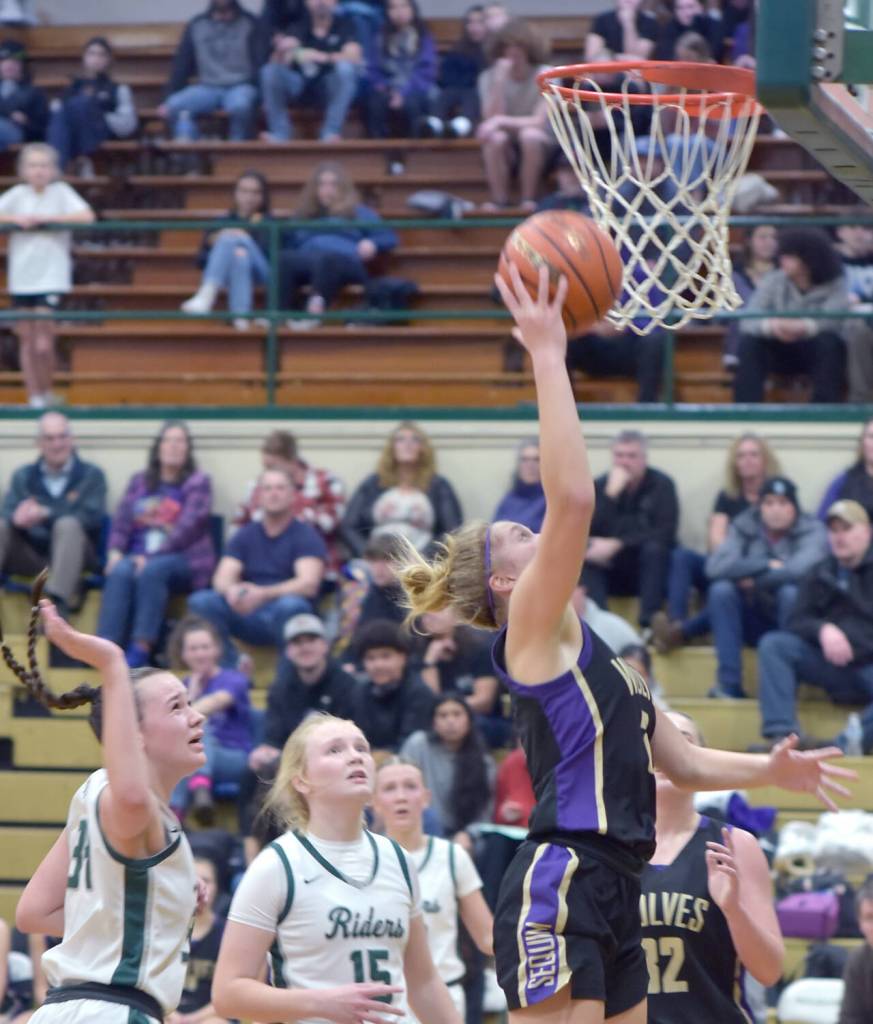 Keith Thorpe/Olympic Peninsula News Group / Sequims Jolene Vaara reaches for the hoop surrounded by, from left, Port Angeles Lexie Smith and Paige Mason and teammate Hailey Wagner on Feb. 6 in Port Angeles.