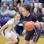 Keith Thorpe/Olympic Peninsula News Group / Sequims Bobbie Mixon, right, moves the ball downcourt past Port Angeles Teanna Clark on Feb. 6 in Port Angeles.