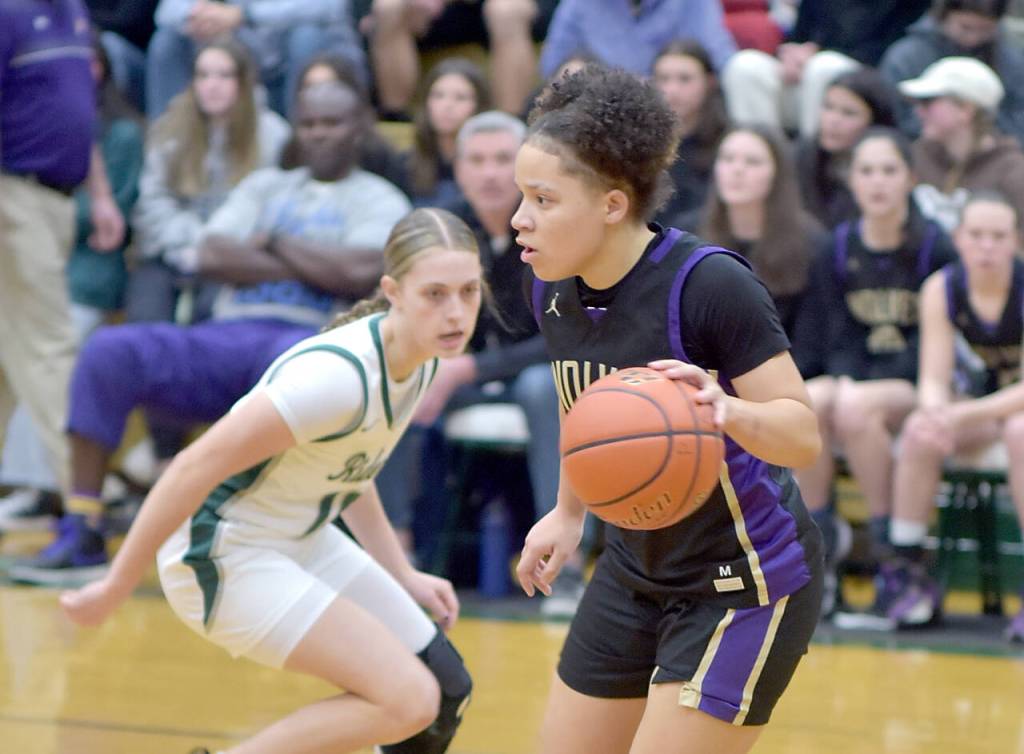 Keith Thorpe/Olympic Peninsula News Group / Sequims Bobbie Mixon, right, moves the ball downcourt past Port Angeles Teanna Clark on Feb. 6 in Port Angeles.