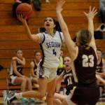 Sequim Gazette photo by Michael Dashiell / Sequim freshman guard Gracie Chartraw drives past Enumclaws Ava Smith in a bi-district tournament game on Feb. 14 in Sequim. Chartraw led the Wolves with 27 points.