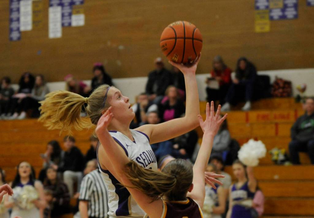 Sequim Gazette photo by Michael Dashiell / Sequims Jolene Vaara drives to the basket for two of her eight points in the Wolves 66-49 loss to Enumclaw on Feb. 14, in Sequims bi-district tourney opener.