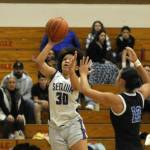 Sequim Gazette photo by Michael Dashiell / Sequims Bobbi Mixon drives past Adrianna Tupolo for a basket in the Wolves bi-district tournament win on Feb. 16.