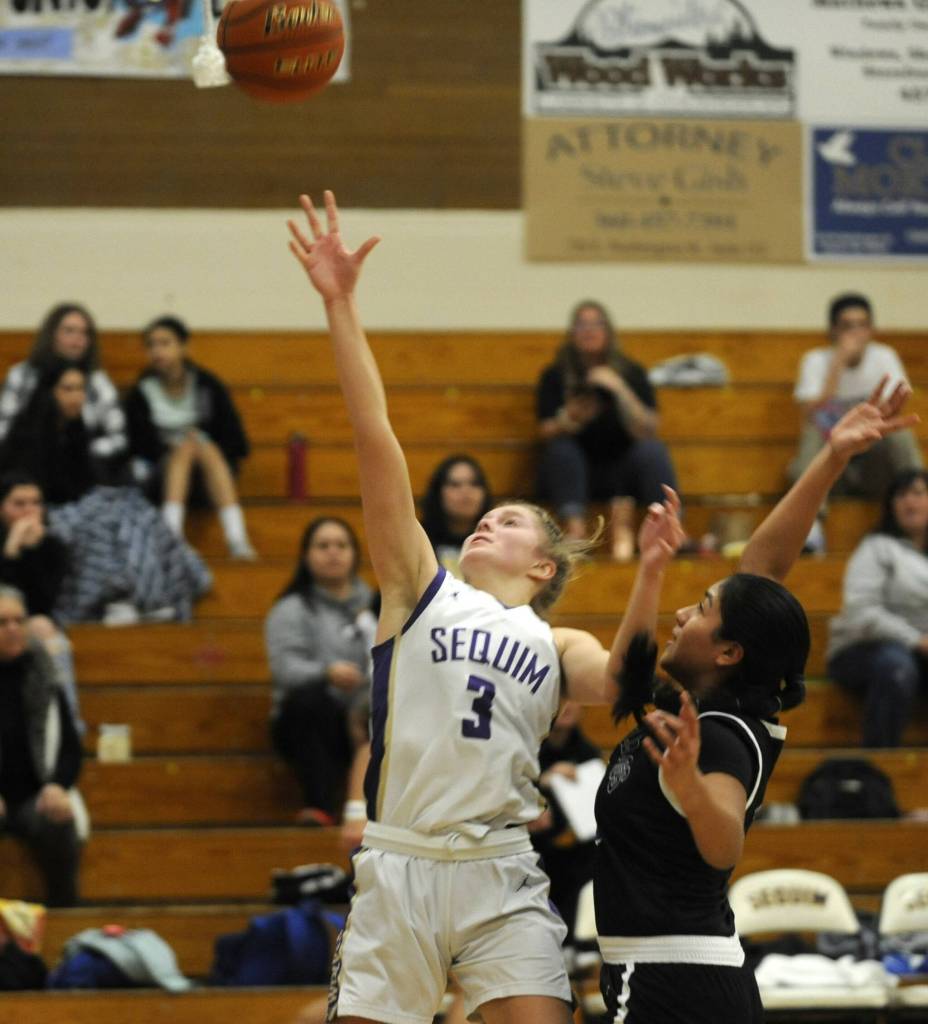 Sequim Gazette photo by Michael Dashiell / Sequims Jolene Vaara, left, drives to the basket for two of her career-high 40 points in a big SHS win over North Mason in a bi-district tournament game on Feb. 16.