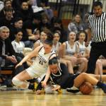 Sequim Gazette photo by Michael Dashiell / Sequims Libby Turella, left, vies with North Masons Adrianna Tupolo for the ball in a bi-district tournament match-up on Feb. 16. Sequim routed the visiting Bulldogs, 76-48.