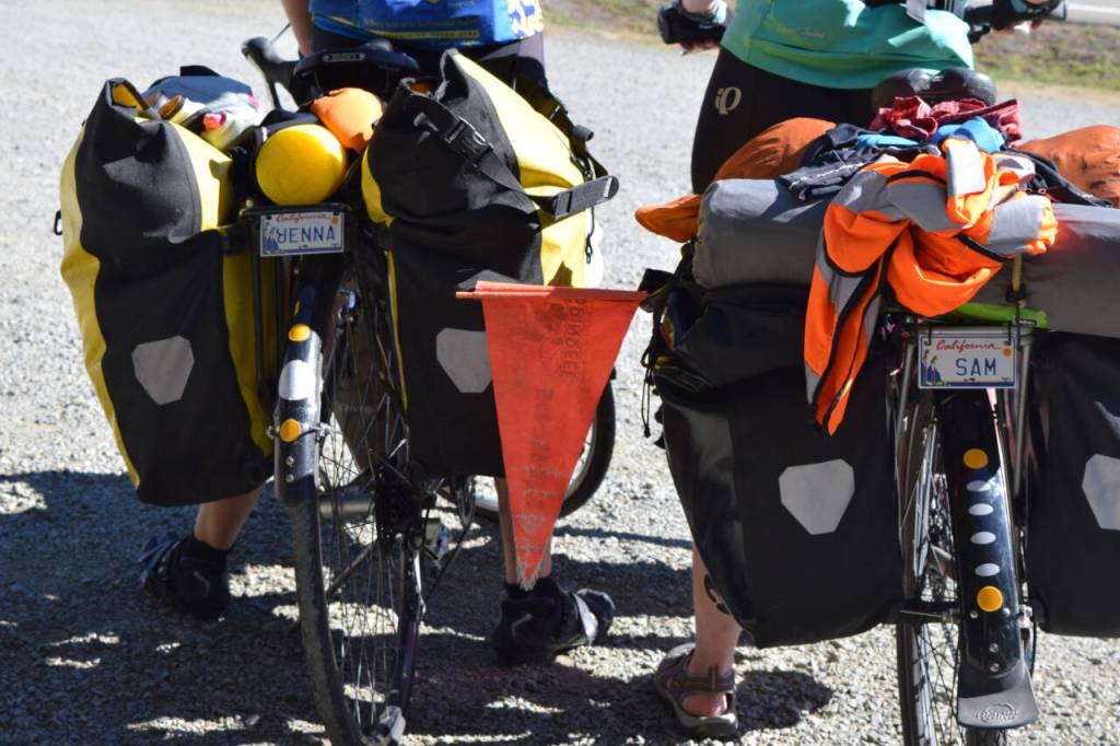 Photo courtesy of Bill Thorness / Two friends are loaded for a bike camping adventure  right down to the personalized bike license plates.