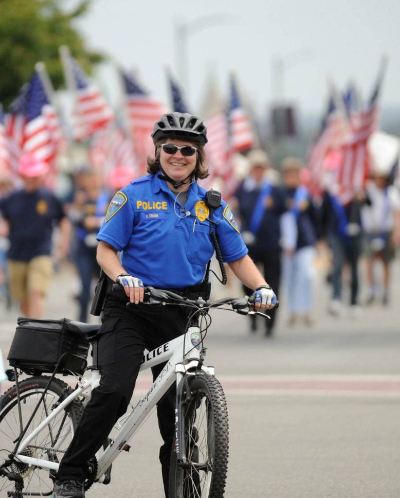 Sequim Gazette file photo by Michael Dashiell/ Sheri Crain, seen here riding in the Sequim Irrigation Festival in May 2016, recently retired as Sequim police chief on Feb. 29 after 33 years. She said its an honor the Sequim Police Department gets to lead the Grand Parade each year.