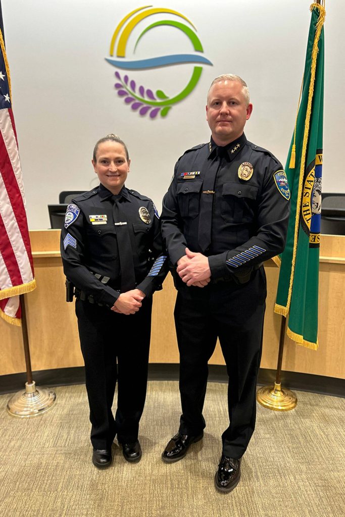 Sequim Gazette photo by Matthew Nash/ Det. Sgt. Kori Malone with Port Angeles Police Department stands with partner Mike Hill after he was named the new Sequim Police Chief. The couple met while working in Sequim, Hill said.