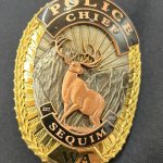 Sequim Gazette photo by Matthew Nash/ Mike Hills Sequim Police Chief badge.