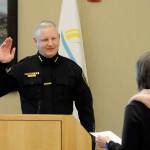 Sequim Gazette photo by Matthew Nash
Mike Hill takes his oath of office on March 1 from acting city clerk Heather Robley to become the City of Sequims new police chief.