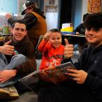 Sequim Gazette photos by Matthew Nash
Sequim Middle School eighth-graders Jude Bower and Ryker Gradillas and Greywolf Elementary kindergartener Brooks Whalen give a thumbs up to a book about volcanoes.