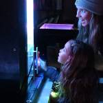 Sequim Gazette photo by Michael Dashiell / Neal Nelson, 5, and mom Hannah, of Sequim, enjoy Ross Browns Interactive Light Experience at the Pioneer Memorial Park clubhouse on March 2.