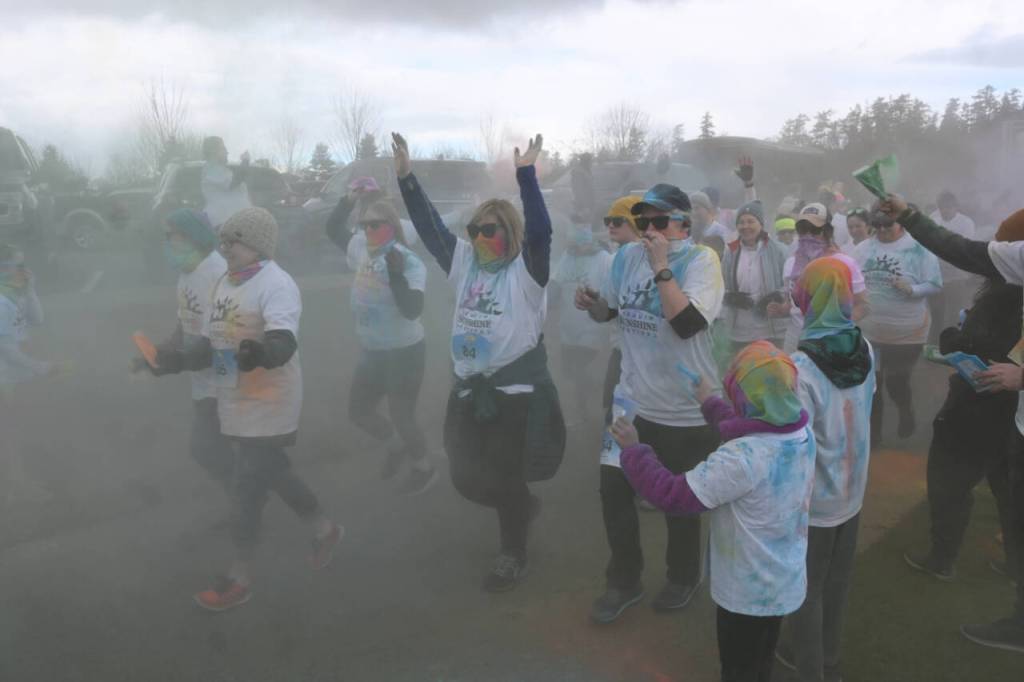 Sequim Gazette photo by Michael Dashiell / Runners and walkers break from the start line at the Sequim Sunshine Festival Sun Fun Color Run at Carrie Blake Community Park on March 2.