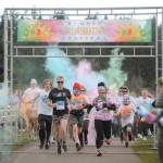 Sequim Gazette photo by Michael Dashiell / Runners and walkers break from the starting line at the Sequim Sunshine Festivals Sun Fun Color Run at Carrie Blake Community Park on March 2.