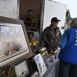 Sequim Gazette photo by Michael Dashiell / Sequim photographer Keith Ross talks with attendees of the Sequim Sunshine Festival on March 2.