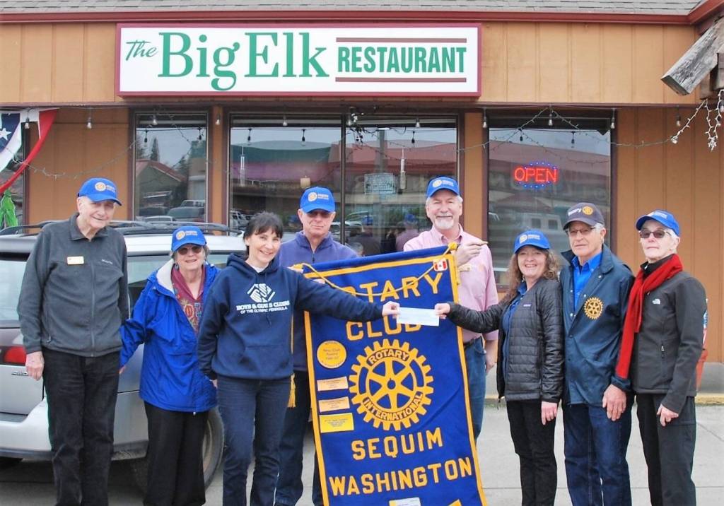 Photo courtesy of Sequim Noon Rotary / Sequim Noon Rotary members present funds for the Boys & Girls Clubs of the Olympic Peninsulas food program to the clubs executive director (and fellow Rotarian) Mary Budke, third from left, in January 2023. Pictured, from left, are Ren Garypie, Margot Hewitt, Budke, Don Sorensen, Stuart Dille, Anna Richmond, Bob Macaulay and Kelly Macaulay.
