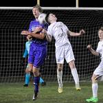 Sequim Gazette photo by Matthew Nash / Sequims Jack Henninger, left, and Port Angeles Daniel Blondolillo vie for the ball in the Wolves season-opening 4-2 win over PA on March 14.