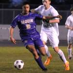 Sequims Mekhi Ashby keeps the ball from a Port Angeles defender in the Wolves 4-2 win over Port Angeles on March 14.