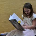 Sequim Gazette photo by Matthew Nash/ Anna-Marie Tax, 7, reads a book about cats as part of a 4-H project shes doing. She wanted to visit the Sequim Library on March 9 before it closed temporarily for three weeks.