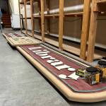 Sequim Gazette photo by Matthew Nash/ The Sequim Library sign is one of the last things to be placed before materials move from the Sequim Avenue library to the temporary space on Washington Street next to the former JCPenney building. The temporary library will be open through expansion and renovation of the existing library.