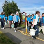 Sequim Gazette photo by Matthew Nash
Sequim High Schools Interact Club members along with a few Sequim Sunrise Rotary members walk along the Olympic Discovery Trail on March 9 for their annual Walk for Water event. They carry water from the Dungeness River to Sequim Middle School to symbolize the journey people take daily for clean water.