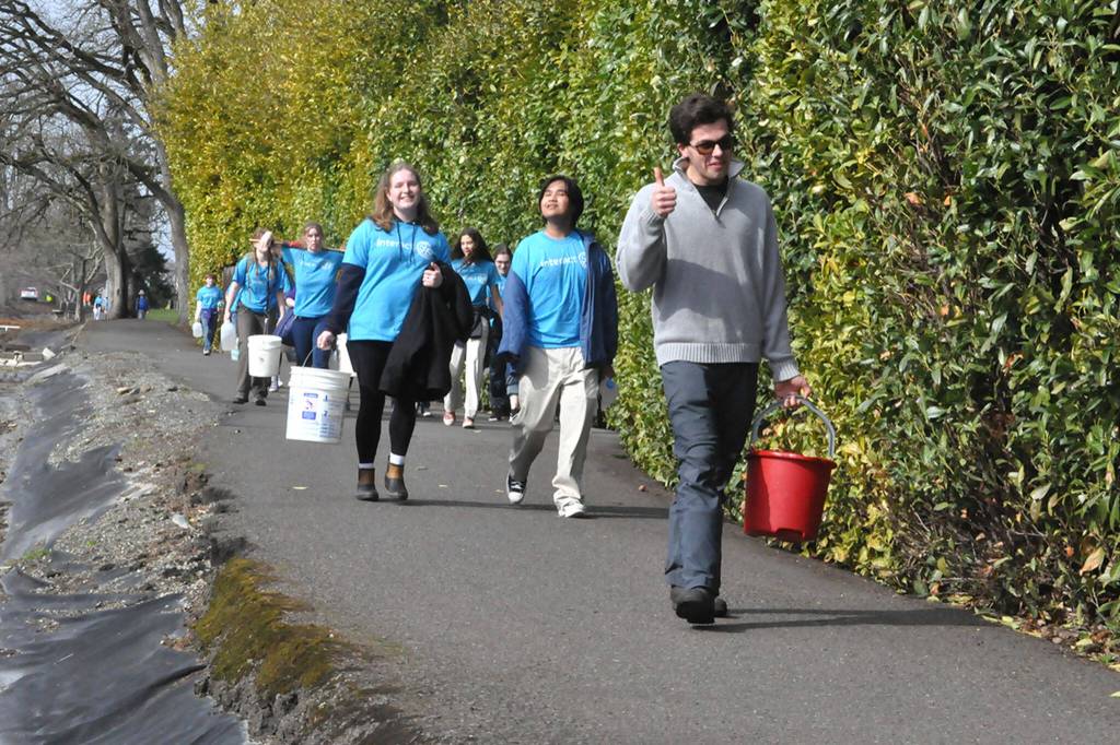 Sequim Gazette photo by Matthew Nash
Sequim High Schools Interact Club members along with a few Sequim Sunrise Rotary members walk along the Olympic Discovery Trail on March 9 for their annual Walk for Water event. They carry water from the Dungeness River to Sequim Middle School to symbolize the journey people take daily for clean water.