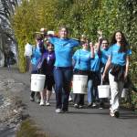 Sequim Gazette photo by Matthew Nash/ Krista Charters, Sequim Interact Club president, front left, carries a yoke alongside fellow club members as a badge of honor, according to club advisor Chelsea Reichner. It was made in 2017 by Calvin Hazard to carry two large buckets more easily during the annual Walk for Water. Charters led the walk from Sequim Middle School to the Dungeness River and back with full containers to symbolize the journey many women and children take daily for clean water. The club seeks funds to build a well for a school in Africa.