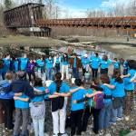Sequim Gazette photo by Matthew Nash
Before heading out with buckets and recycled containers filled with water at their annual Walk For Water event on March 9, Sequim High Schools Interact Club members do a motivating chant. Students carried water from the Dungeness River to Sequim Middle School as part of a fundraiser to help build a well for a school in Ghana. See story, A-5.