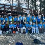 Sequim Gazette photo by Matthew Nash/ Students gather by the Dungeness River Railroad Bridge before walking two miles with containers filled with water on March 9 to symbolize the struggle people face everyday walking for clean water.