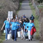 Sequim Gazette photo by Matthew Nash
Sequim High Schools Interact Club members along with a few Sequim Sunrise Rotary members walk along the Olympic Discovery Trail on March 9 for their annual Walk for Water event. They carry water from the Dungeness River to Sequim Middle School to symbolize the journey people take daily for clean water.