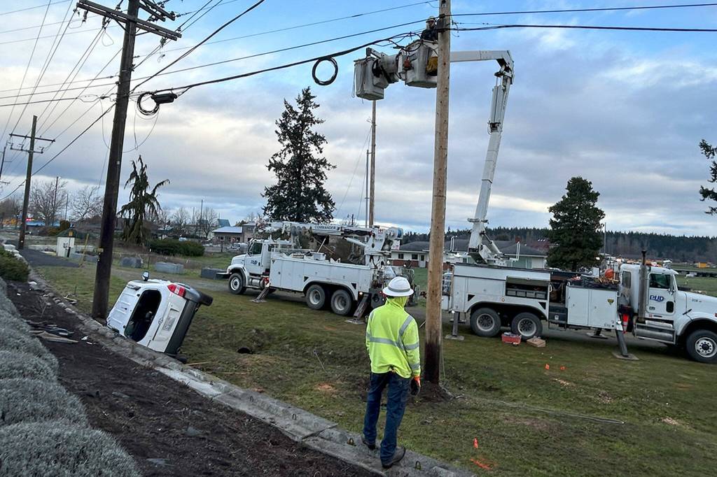 Sequim Gazette photo by Matthew Nash/ Clallam PUD crews worked through the night/morning of March 12 to replace a power pole and restore electricity after a sport utility vehicle struck a power pole.