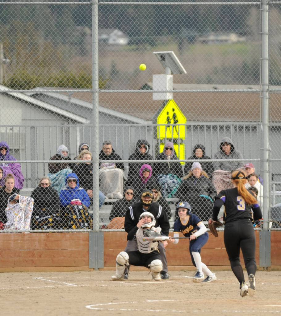 Sequim Gazette photo by Michael Dashiell / Sequim catcher Mikki Green keeps her eye on a pop-up in the fourth inning in the Wolves 7-3 win over visiting Forks on March 12.