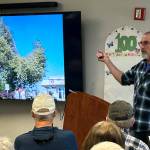 Sequim Gazette photos by Matthew Nash
Master Gardener Keith Dekker shares some pruning and planting tips alongside some helpful visual aids, such as planting away from power lines due to safety hazards and because public utility agencies have the right to cut trees away from lines.