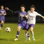 Sequim Gazette photo by Michael Dashiell / Sequims Kyhlan Henderson, left, and North Kitsaps Logan Anderson vie for the ball in the second half of a March 21 league match-up in Sequim.