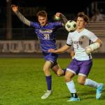 Sequim Gazette photo by Michael Dashiell / Sequims Mason Rapelje, left, pressures North Kitsaps Mason Chmielewski in the second half of an Olympic League match-up on March 21. North Kitsap won, 4-0.