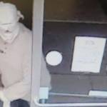 Surveillance video footage shows a man brandishing a gun at the Dollar Tree store in Port Angeles. (Clallam County Sheriff's Office)