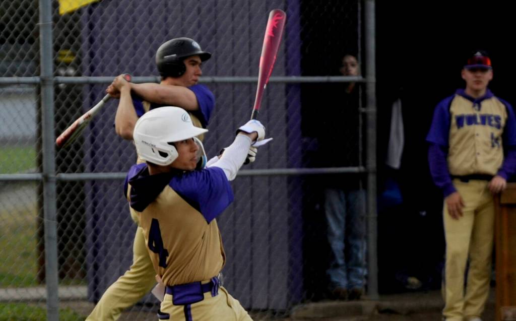 Sequim Gazette photo by Michael Dashiell / Sequims Bryant Laboy laces a single into left field as the Wolves take on North Kitsap on March 21.