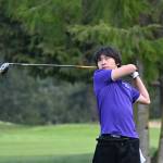 Sequim Gazette photo by Michael Dashiell / Sequims Joey Kang tees off as he and the Wolves take on Bainbridge at home on March 21.