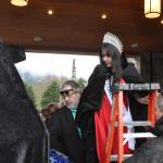 Sequim Gazette photo by Matthew Nash/ Princess Kailah Blake climbs onto the royalty float for the first time on March 23. She and fellow Irrigation Festival royalty will go to 14 parades this year.