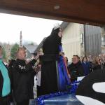 Sequim Gazette photo by Matthew Nash/ Queen Ariya Goettling climbs onto the royalty float for the first time on March 23. She and fellow Irrigation Festival royalty will go to 14 parades this year.